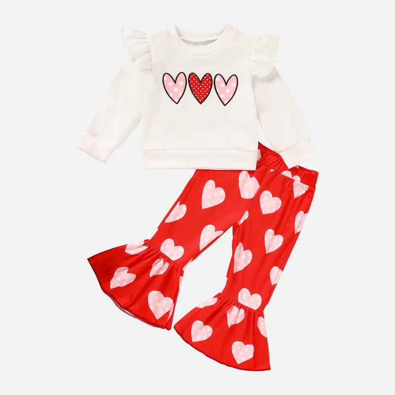Children's outfit with a white top and red bell-bottom pants featuring heart patterns on a white background. Valentines Day Baby Girls Toddler