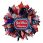 Decorative wreath with red, white, and blue colors featuring 'God Bless America' fourth of July decoration