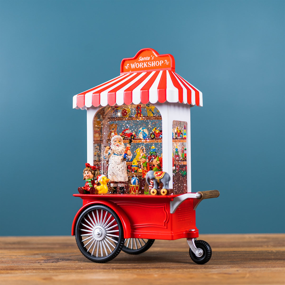 10.75 in Santa's Workshop Snow Globe – manufacturer photo 2