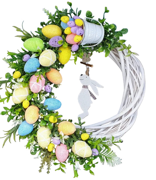 Grapevine Easter wreath with colorful eggs and a white bunny silhouette 