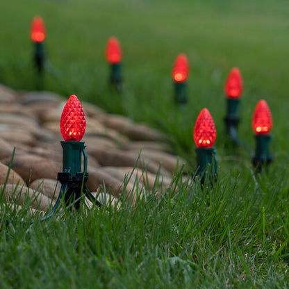 Red C7 OptiCore LED Christmas pathway lights with PathPRO stakes in six colors