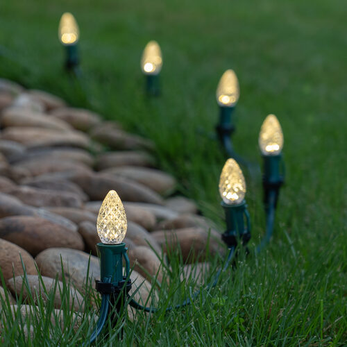 Warm White C7 OptiCore LED Christmas pathway lights with PathPRO stakes in six colors