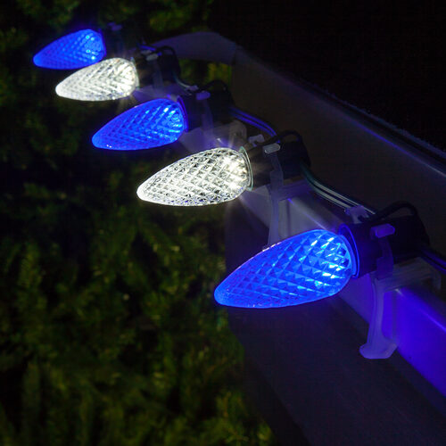Blue white C9 OptiCore LED Christmas string lights on green wire