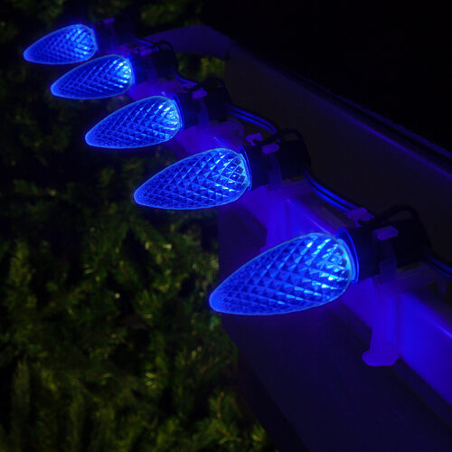 Blue C9 OptiCore LED Christmas string lights on green wire