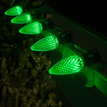Green C9 OptiCore LED Christmas string lights on green wire