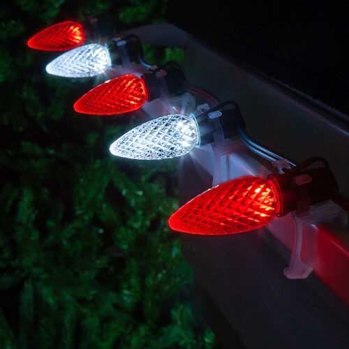 Red white C9 OptiCore LED Christmas string lights on green wire