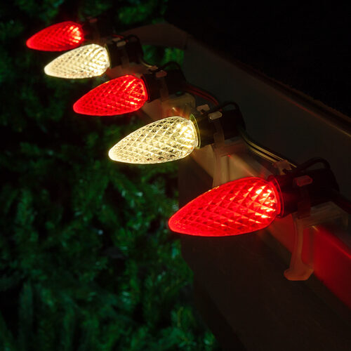 Red warm white C9 OptiCore LED Christmas string lights on green wire