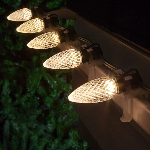 Warm White C9 OptiCore LED Christmas string lights on green wire