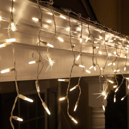 Warm White 70 LED M5 Twinkle icicle Christmas lights on white wire