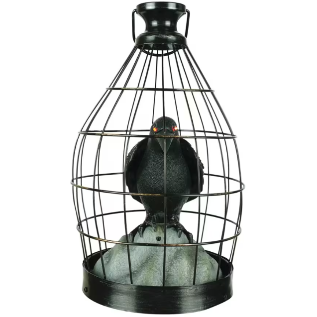 This creepy caged black crow flaps its wings and squawks when someone is near. Welcome guests to your Halloween party with this frighteningly unique Halloween decoration. This crow is also a fantastic prop for a haunted house. From his metal prison, your new feathered fiend watches the world with glowing eyes. Sound and motion activated. Requires 3 AA batteries, not included. Imported.