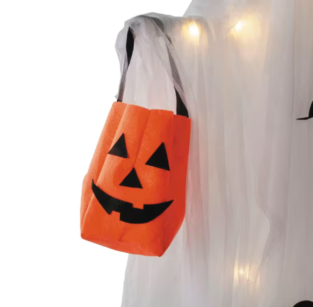 Halloween pumpkin bag with a ghost costume in the background