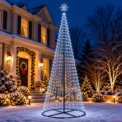 Giant 12 Ft cool white animated LED Christmas light show tree with 700 lights and illuminated star topper displayed in a snowy front yard beside a decorated two-story home.