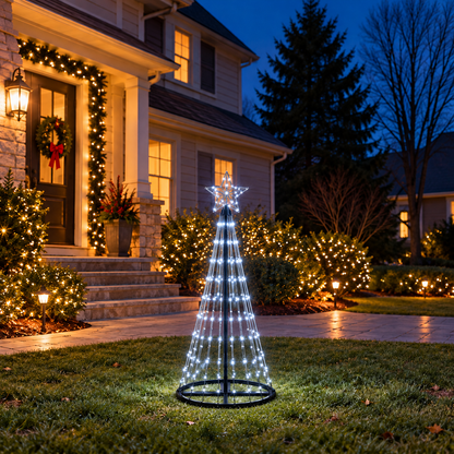 4 Ft cool white animated LED Christmas light show tree displayed in a decorated front yard at dusk with white star topper and black circular base.