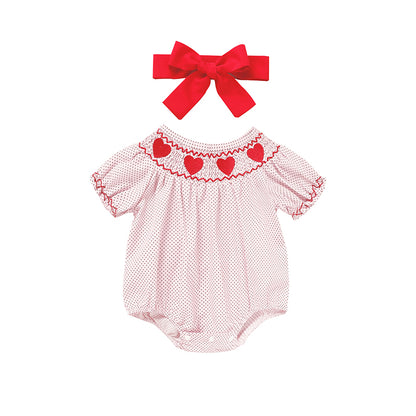 Baby romper with heart details and a matching headband on a white background Valentines Day