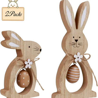 Two wooden Easter bunny decorations with eggs