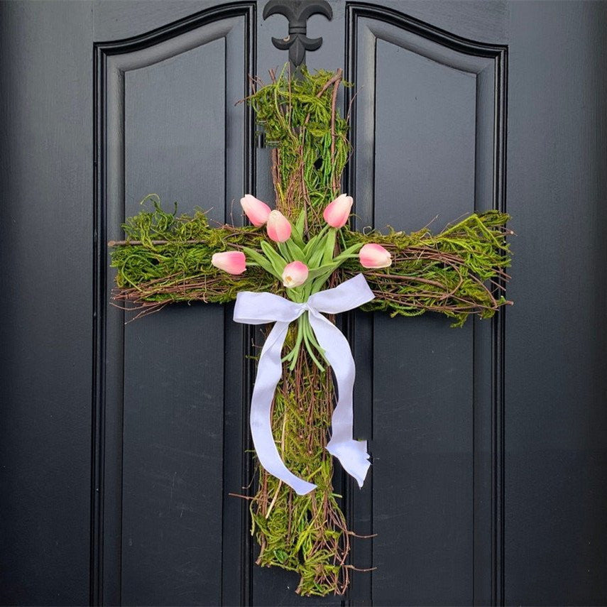 Decorative grapevine cross wreath with pink tulips and greenery Easter decoration