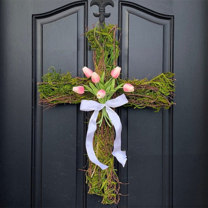 Decorative grapevine cross wreath with pink tulips and greenery Easter decoration