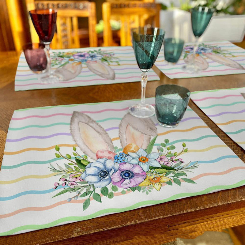 Easter-themed placemats featuring bunny ears and floral designs.
