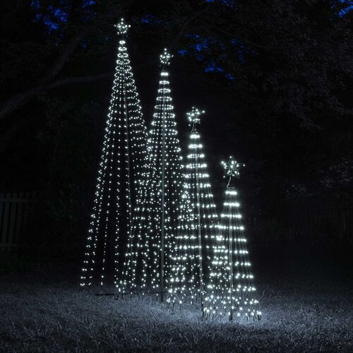 Multiple cool white animated LED Christmas light show trees of different heights illuminated together outdoors at night.