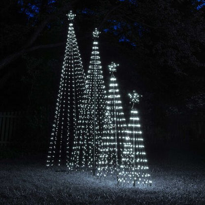 Multiple cool white animated LED Christmas light show trees of different heights illuminated together outdoors at night.