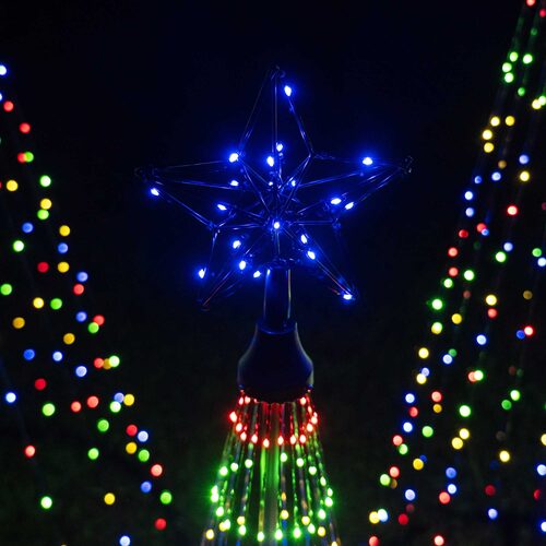 Close-up of glowing blue LED star topper on a Wintergreen Lighting multicolor animated Christmas light show tree.