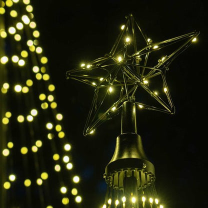 Wintergreen Lighting warm white animated LED Christmas light show trees in multiple sizes displayed outdoors with glowing star toppers. 